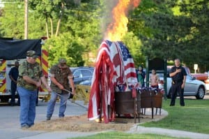 Photo courtesy of the City of Dearborn. U.S. flags no longer fit for service are respectfully burned according to American Legion protocol during the city's annual Flag Day service. This year’s event is at 6 p.m. June 14 at Ford Field Park.