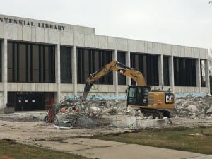 Photo by Zeinab Najm. City of Dearborn workers remove the fountain which sat outside the Henry Ford Centennial Library for over 50 years to make way for the city’s new Veterans Park and War Memorial scheduled to open in May.