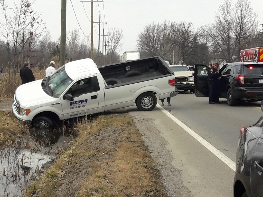 Photo by Angela Nims A four-vehicle collision on southbound Inkster Road about 3:30 p.m. Feb. 22 injured at least one person. The driver of the first vehicle was stopped and the driver of the second vehicle, driven by John Williams, stopped behind her. Williams then saw the third vehicle barreling toward him in the rearview mirror, but said he couldn’t do anything about it. A fourth vehicle then hit the third vehicle, causing the third vehicle to grind further into Williams’ car and forcing him into the first vehicle. Adding to the mix, another driver heading north on Inkster Road saw the crash and turned around to help. He inadvertently drove into a ditch. Romulus Police are handling the crash and did not return calls as of publication.