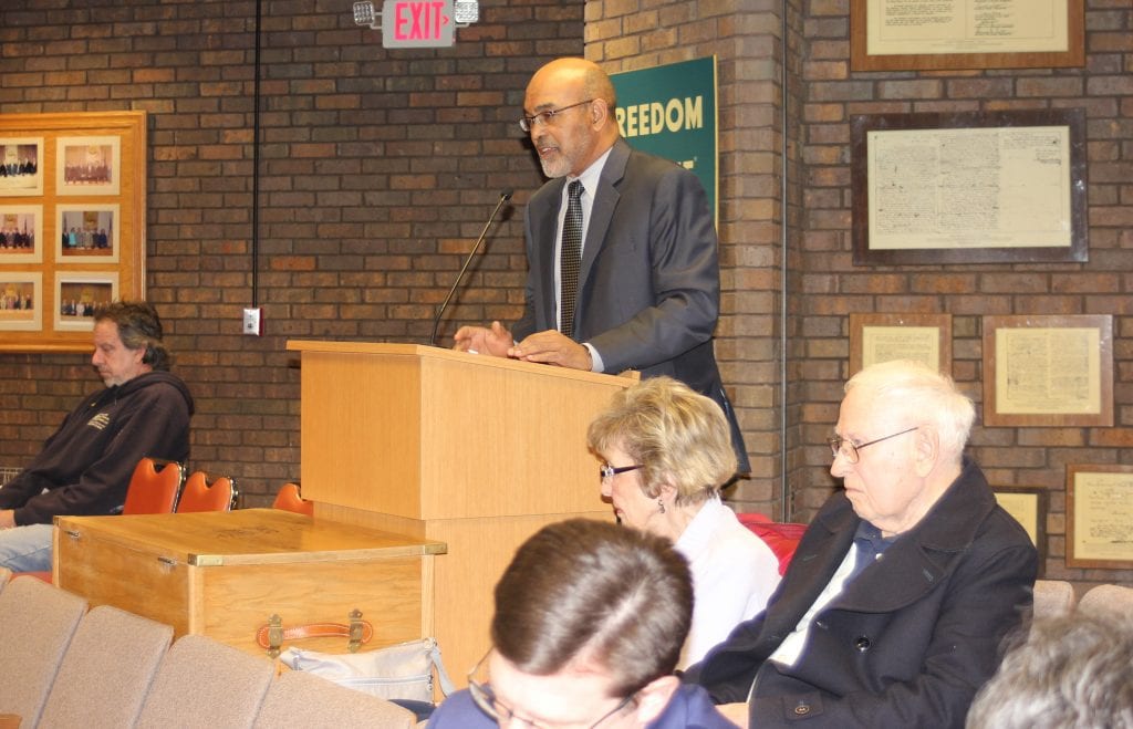 Photo by Sue Suchyta Wayne County Treasurer Eric Sabree explains to city officials why the city received $777,628.61 instead of the anticipated $1.4 million in back taxes it anticipated receiving from Crown Enterprises when it acquired the former McLouth property from the Wayne County Land Bank.