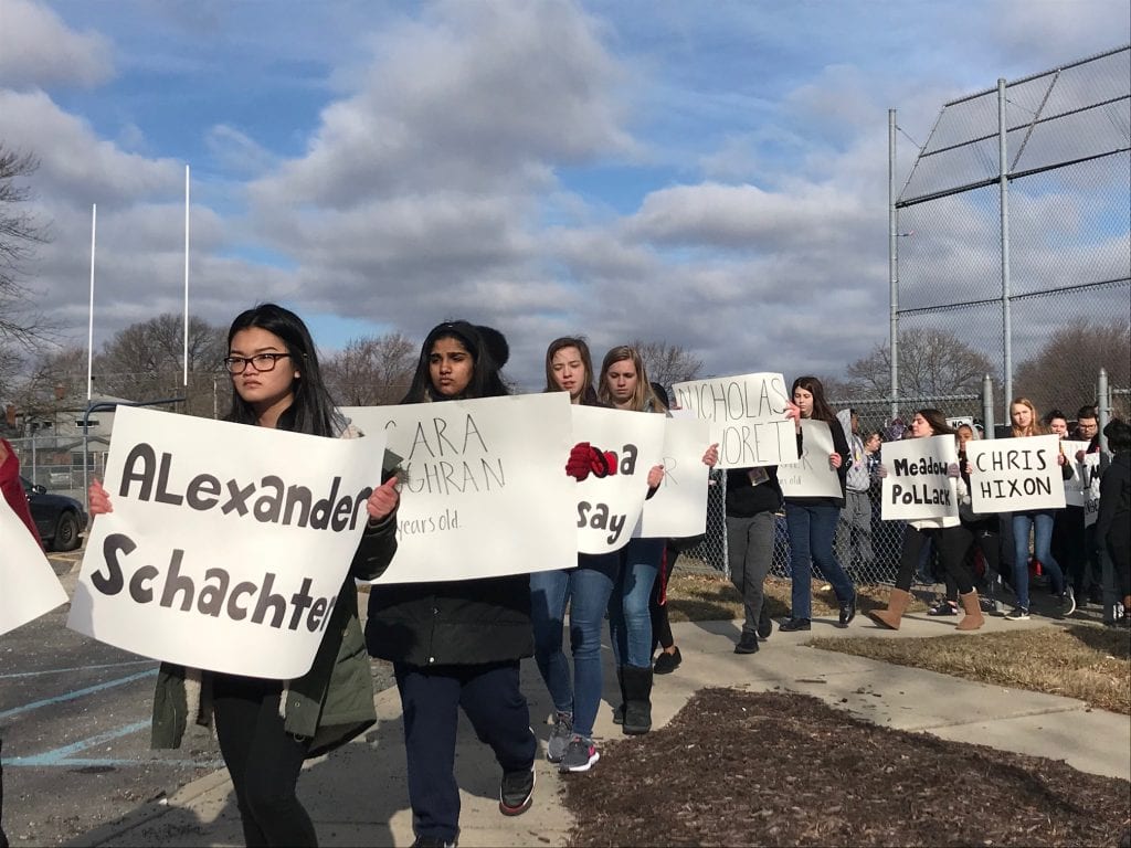 Photo by Zeinab Najm Annapolis High School students carry signs with the names of the 17 Stoneman Douglas High School shooting victims during a 17-minute walkout that took place nationwide March 14.