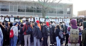 Photo by Ellen Roycroft Students at Dearborn High School display signs with names and photos of the 17 victims of the Feb. 14 Stoneman Douglas High School shooting, during the nationwide 17-minute walkout.