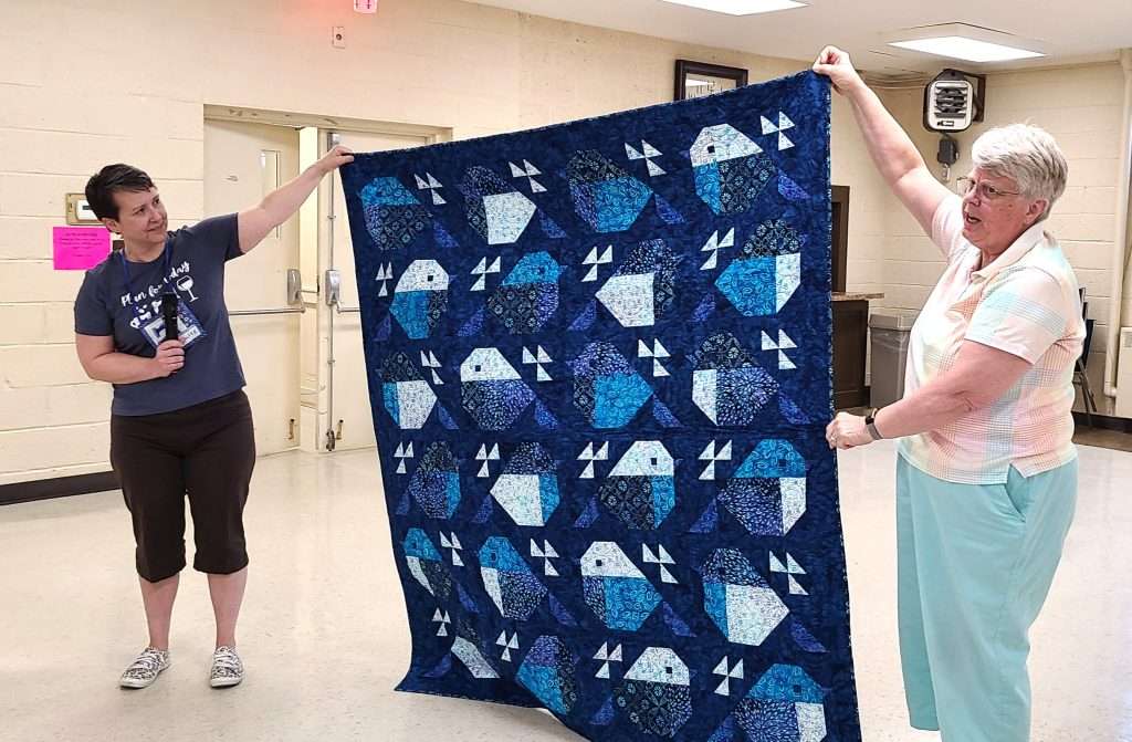Photo by Sue Suchyta Quilter Janet Steele of Detroit shows a quilted purse she made during a May 11 meeting of the General Henry Dearborn Quilting Society at Cherry Hill Presbyterian Church.